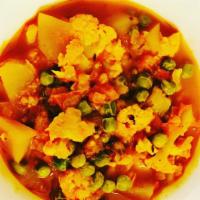 Aloo Matar Gobi · Potatoes, peas and cauliflower cooked with spices.