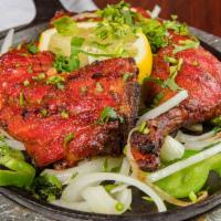 Tandoori Chicken · Chicken leg marinated in yogurt, herbs and spices then grilled in tandoor oven.