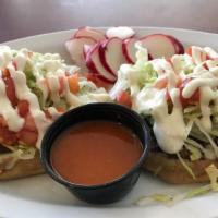 Two Sopes · Deep dish tortilla, any choice of meat - azada or chicken. Served with beans, lettuce, sour ...