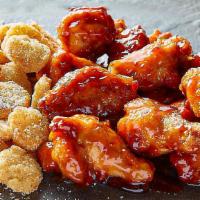 14 Wing Combo · 14 bone-in wings, ranch tots, and choice of 2 dipping sauces.