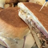 Cuban · House roasted mojo pork, ham, Swiss cheese, pickles, mustard, and mayo; pressed on a Cuban s...