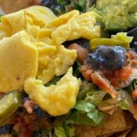 Nacho Jams · Tortilla chips, shredded mojo pork, black beans, tomato, lettuce, jalapeños, Chihuahua chees...