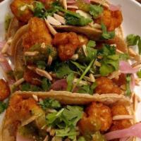 Cauliflower Tacos · Breaded cauliflower florets, roasted almonds, pickled red onion, and sweet tomatillo sauce; ...