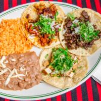 Taco Dinner · Tacos with your choice of meat. served with rice and beans.