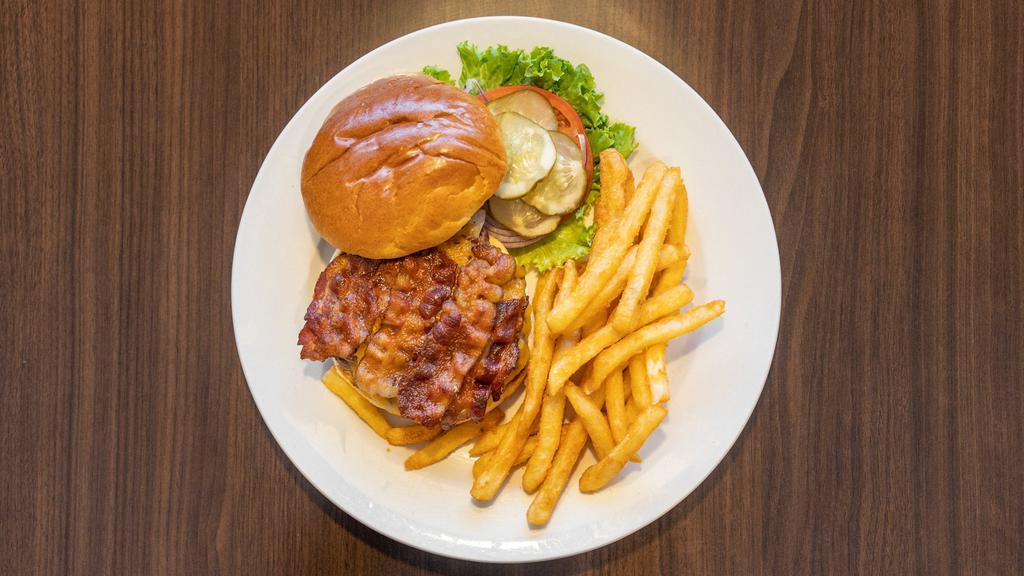 The Stack Burger · We slather your burger in our house-made barbeque sauce then top it with bacon, Cheddar and grilled onions.