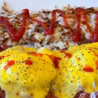 Irish Benny · 2 poached eggs ON top OF English muffin with zesty grilled corned beef hash, tomato and topp...