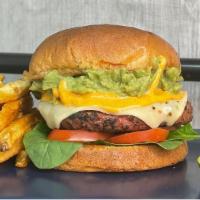 The Zack · House-made burger patty with pepperjack cheese, spinach, tomato, and smashed avocado, with c...