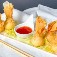 Crab Rangoon (5 Pcs.) · Crabmeat and cheese in pouches deep fried.