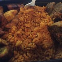 Jollof Meal With Beef · Comes with a full plate of Jollof rice, Plantains and Goat meat.
