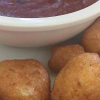 Cheese Curds · Served with marinara sauce.