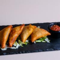Beef Samosa (3 Pcs) · Very thin sheet of dough filled with ground Beef mixed with blend of spices  and deep fired