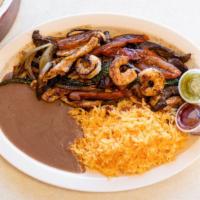 Fajita Mixta · Grilled chicken, steak and shrimp, served with rice and beans, with fresh tortillas.