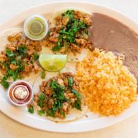 3 Tacos · Steak or chicken tacos, served with rice and beans, with fresh tortillas.