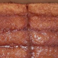 Cinnamon Buttery Breadsticks · House Made Dough Lightly Cooked, Topped With Cinnamon, Sugar, Butter,& Honey.