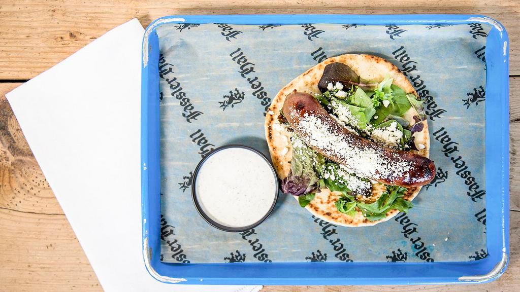 Lamb Sausage · Served on a pita with spring mix, feta cheese, and a side of tzatziki sauce.