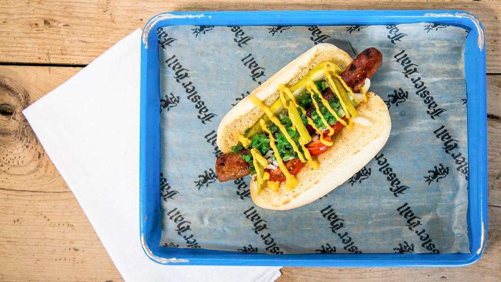 Chicago Dog · Housemade Frankfurter topped with pickle, sport pepper, tomato, onion, yellow mustard, neon relish, celery salt.