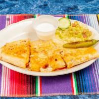 Andrea Special · A large quesadilla made with mozzarella cheese, choice of meat with guacamole, sour cream an...