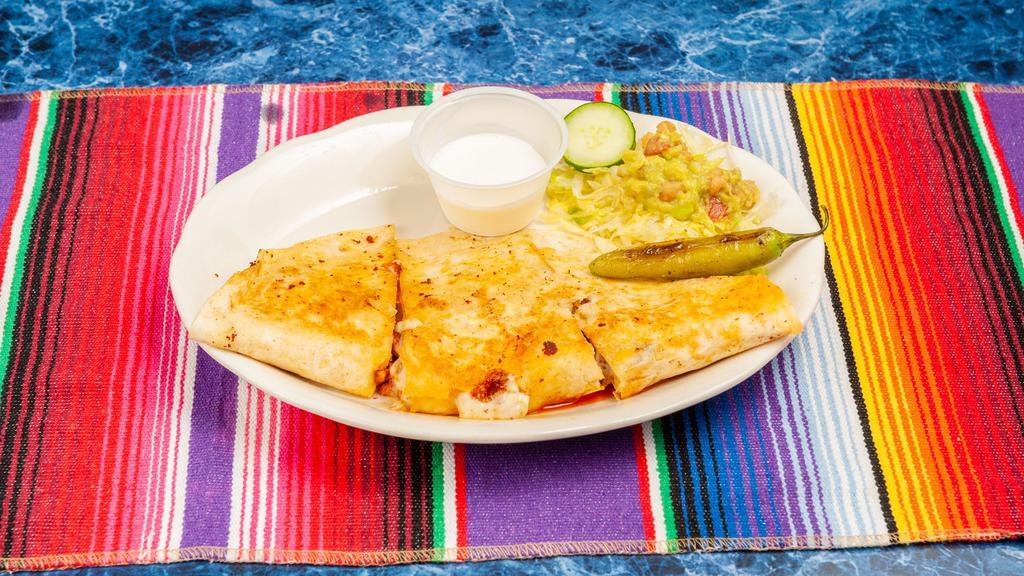 Andrea Special · A large quesadilla made with mozzarella cheese, choice of meat with guacamole, sour cream and lettuce.