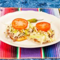 Sopes · Choice of meat with beans, lettuce, tomatoes, guacamole and cheese.