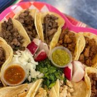 Option 2  · 12 tacos in a heart shaped plate with the choice of three meats! and the choice of two flavo...