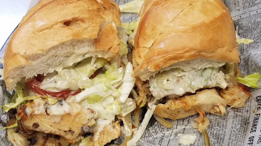Cajun Chicken · Strips of cajun chicken breast with sautéed mushrooms and onions. Served on a French roll, baked with a blend of cheeses, topped with lettuce, tomato, and our special homemade sauce.
