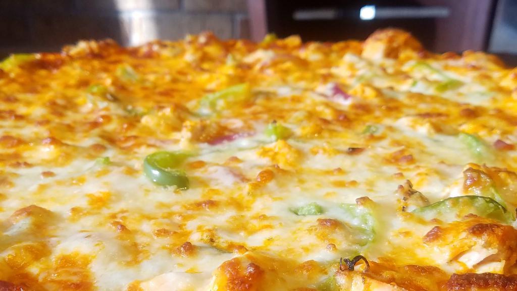 Buffalo Chicken Pizza · Fresh dough brushed with a spicy buffalo sauce and our creamy homemade ranch, topped with chicken, onion, green pepper, and provolone cheese.