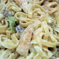 Chicken Alfredo · Strips of chicken breast with sliced mushrooms, onions and spinach sautéed in a touch of gar...