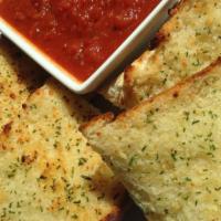 Garlic Bread · A French roll topped with butter, garlic, and Italian seasonings, served with sauce for dipp...