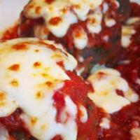 Italian Meatballs (2) · Two large, homemade meatballs served with tomato meat sauce, and sprinkled with melted mozza...