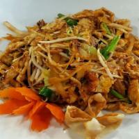 Pad Thai · Famous rice noodle dish stir-fried with meat, egg, bean sprouts, spring onion and cabbages w...