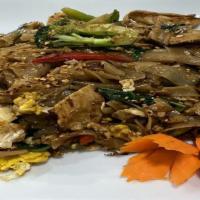 Pad Key Maw · A spicy noodle dish, stir-fried flat noodles with gai-lan, garlic, bell pepper and basil lea...