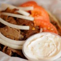 Gyro · Mouth watering Gyro with Tomato, Onions, Tzatziki sauce (on the side) served on Pita bread.....