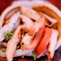 Grilled Chicken Pita · Charbroiled Chicken Breast, Lettuce, Tomato, Onion, Tzatziki sauce (on the side) served on P...