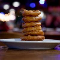 Beer Battered Onion Rings · After a long day, nothing goes better with a frosty mug of beer than a heaping pile of our s...