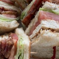 Chicken Club · Triple decker of chicken, bacon, lettuce, tomato and mayonnaise.