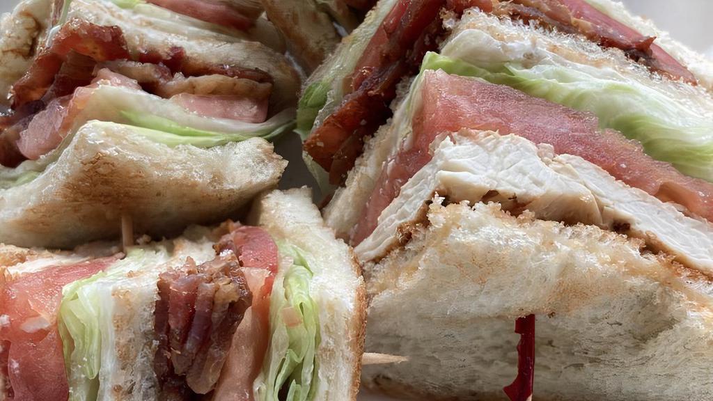 Chicken Club · Triple decker of chicken, bacon, lettuce, tomato and mayonnaise.