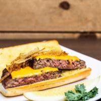 Zazzo Burger · 1/2 lb. burger on garlic bread with American cheese and grilled onion.