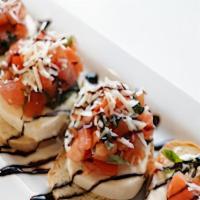 Bruschetta · 5 pieces of toasted bread topped with tomato, garlic, basil, Parmesan cheese and olive oil.