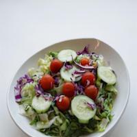 Small House · Mixed greens with tomato, green pepper, carrots, cabbage and cucumbers.