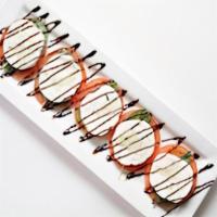 Caprese Salad · Fresh mozzarella, basil, and tomato.  Served with a roll.