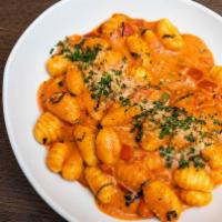 Gnocchi · Tomato, basil, and cream sauce. Served with a roll.