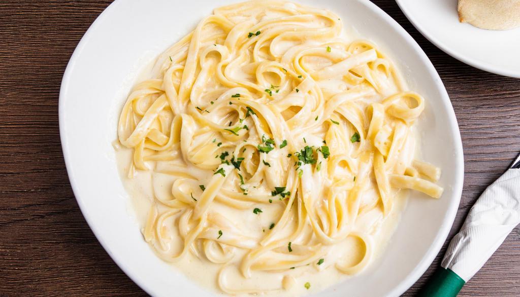 Fettuccini Alfredo · Served with a roll.