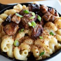 Brisket Skillet Mac And Cheese · Cavatappi pasta, BBQ beer braised brisket, queso, smoked gouda, toasted panko bread crumbs, ...