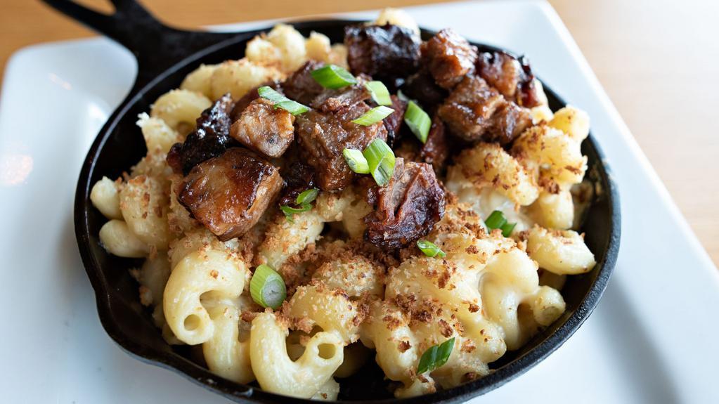 Brisket Skillet Mac And Cheese · Cavatappi pasta, BBQ beer braised brisket, queso, smoked gouda, toasted panko bread crumbs, green onions