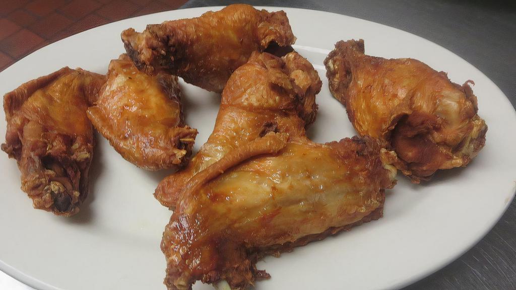 Chicken Wings · Fried chicken and hot sauce.