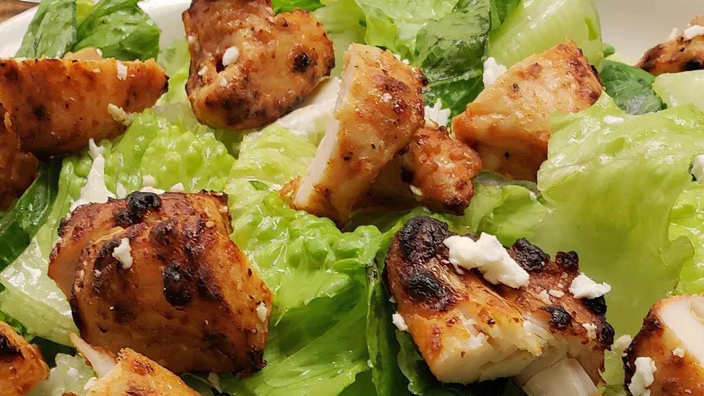Chicken Salad · Greek salad topped with marinated chicken.