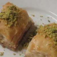 Baklava · Layers of flaky filo pastry filled with crushed nuts and sweetened with syrup.