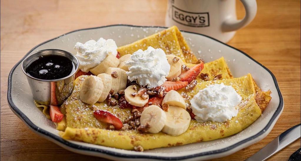 Eggy'S Crepes · Crepes stuffed with strawberries, bananas and pecans, topped with whipped cream