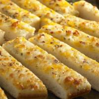 Large Cheese Sticks · Smoked Provolone Cheese and Cheddar Cheese
On Pan Crust Includes Dipping Sauce and Xtra Cheese