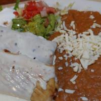 Seafood Chimichanga · 2 chimichangas stuffed shrimp and imitation crab topped with cheese dip. Served with lettuce...